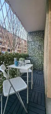 a white table and chairs sitting on a patio at Charmant studio à Castres in Castres