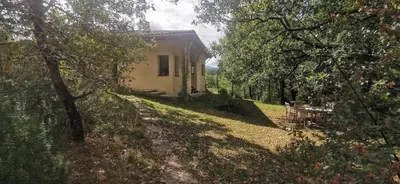 a small house in the middle of a forest at Chambre confortable à la campagne in Dun