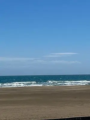 an empty beach with the ocean in the background at APPARTEMENT Rénové de type 3 VUE MER in Port-la-Nouvelle