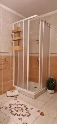 a shower stall in a bathroom with a toilet at Chez Céline, plein centre ville in Narbonne