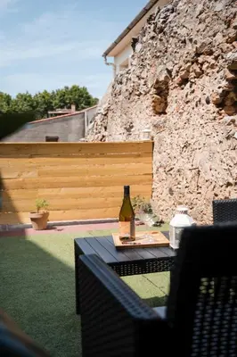 a bottle of wine sitting on top of a table at Hygge en Méditerranée in Salses-le-Chateau