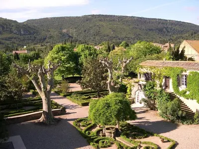 an aerial view of a garden with trees and a house at Appartement dans l'aile du château 130M2 6 personnes in Carcassonne
