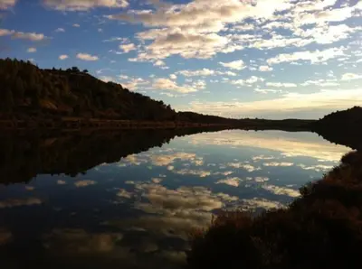 a large body of water with clouds in the sky at Le Doul Jolie villa au calme climatisée grande piscine jardin in Peyriac-de-Mer