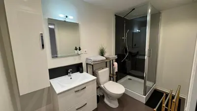 a bathroom with a toilet and a sink and a shower at My Agradi, Maison de village in Les Martys