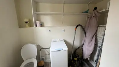 a small bathroom with a toilet and a shelf at My Agradi, Maison de village in Les Martys