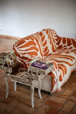 a living room with a couch and a table at Domaine Castelnaut gîte et château in Laroque-de-Fa