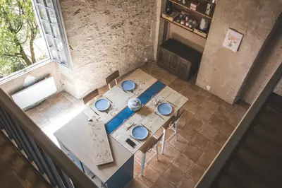 an overhead view of a table and chairs in a room at L'intendance - calme et cosy, vieilles pierres in Saint-Félix-Lauragais