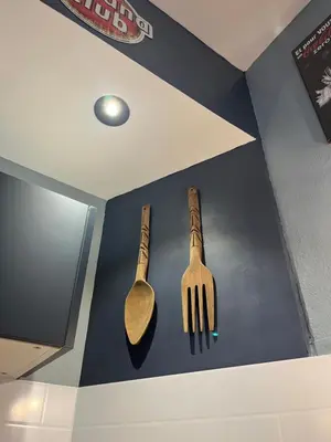 a fork and a spoon hanging on a wall at Magnifique et grand loft classé 4 étoiles in Lavelanet