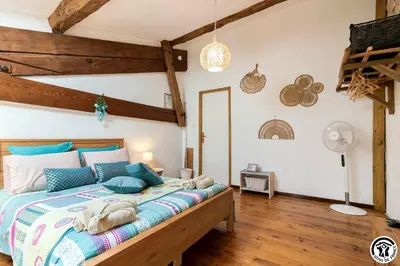 a kitchen with a counter top with a microwave at Chambres et appartement de charme dans ferme de caractère - billard, jardin et cheminée - près du Canal du Midi in Lagarde