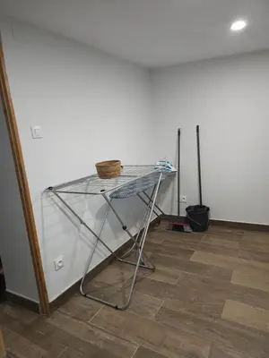 a glass table in front of a white wall at Le Nid de Moline 3 étoiles in Villemoustaussou