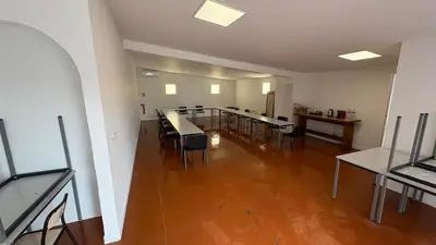 an empty room with tables and chairs in a building at Local, Training room, seminars, meetings, courses, formation in Castelnaudary