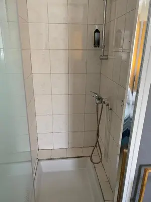 a bathroom with a shower with a glass door at Chez Eugénia & Frédéric in Port-la-Nouvelle