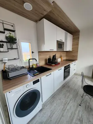 a kitchen with a washing machine and a sink at Le Roof Top du Port, Nouveau, Bbq Duplex Clim Parking in Gruissan