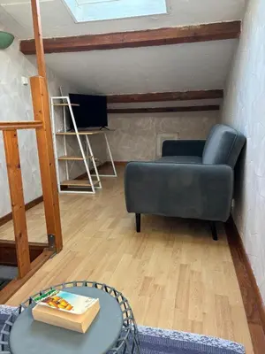a living room with a couch and a table at la saline in Peyriac-de-Mer