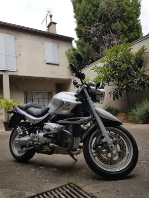 a motorcycle parked in front of a house at Le Patio in Castelnaudary