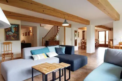 a living room with a couch and a table at Gite rural de Bergnes à l'ombre des grands pins in Campagne-sur-Aude