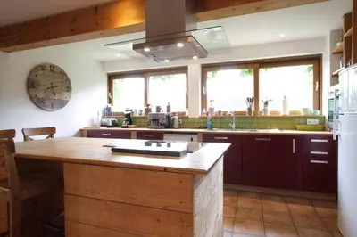 a kitchen with a large wooden island in a kitchen at Gite rural de Bergnes à l'ombre des grands pins in Campagne-sur-Aude