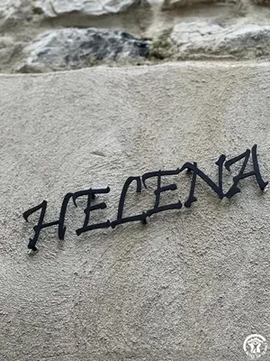 a piece of writing on the side of a rock at Helena in Quintillan