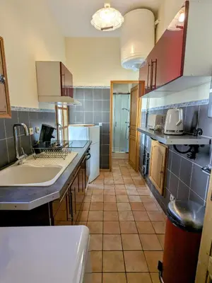 a kitchen with a sink and a counter at Studio cosy et spacieux in Carcassonne