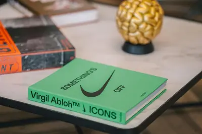 a book sitting on top of a table at Luxueux-Climatisation-3 chambres-2SDB-Garage -AJ in Carcassonne