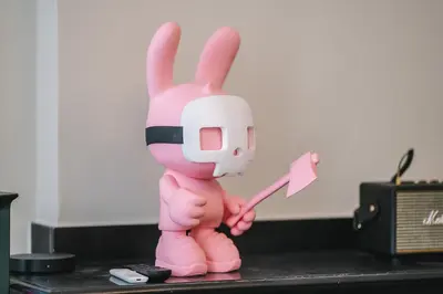 a pink bunny figurine holding a spatula at Luxueux-Climatisation-3 chambres-2SDB-Garage -AJ in Carcassonne
