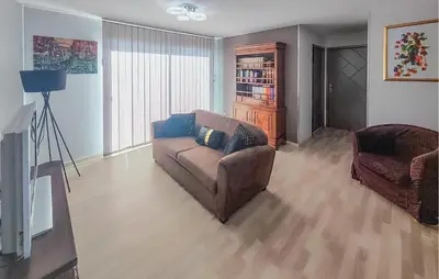 a living room with a couch and a chair at Cozy Home In La Redorte in La Redorte