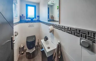 a bathroom with a sink and a toilet and a mirror at Cozy Home In La Redorte in La Redorte