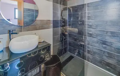 a bathroom with a sink and a mirror at Cozy Home In La Redorte in La Redorte