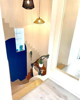 a stairwell in a house with a mirror at La Maison Nikaïa in Narbonne