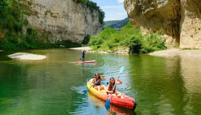 a group of people in a kayak on a river at Maison de vacances familiale 4 chambres in Quillan