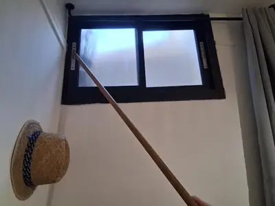 a room with two mop and a window at Studio Robine les halles avec clim in Narbonne