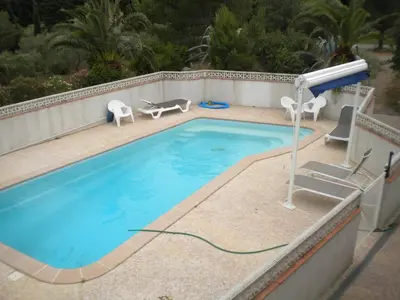 a swimming pool with a hose coming out of it at Le Fenouillet Chambres D'hotes proche des Grands Buffets in Narbonne