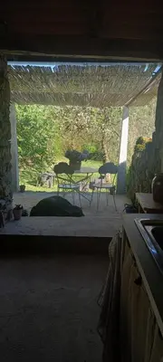 a view of a patio with chairs and a table at Gîte familial 10 places in Castelnau-de-Brassac