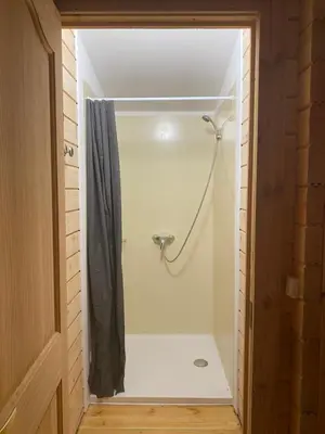 a bathroom with a shower with a shower curtain at Échappée Vigneronne in Pennautier