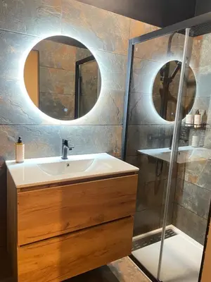 a bathroom with a sink and a mirror at Villa de charme avec spa in Pamiers