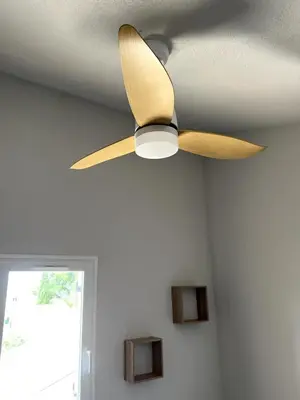 a ceiling fan hanging from a ceiling at La franqui , nouveau , Duplex pour 2 ou 3 ,piscine, mer ,soleil , station familiale in La Franqui-Plage