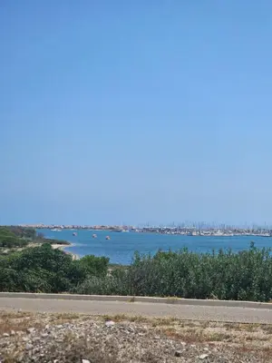 a view of a river with boats in the water at Volet verts 8 personnes in Fitou