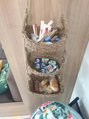two baskets on a shelf with food and bread at La Tropicale, studio climatisé avec parking, Proche Cité médiévale in Carcassonne