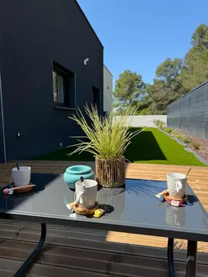 a patio with tables and chairs and a pool at New villa 2025 Pyrenees View, Pool & Comfort in Carcassonne