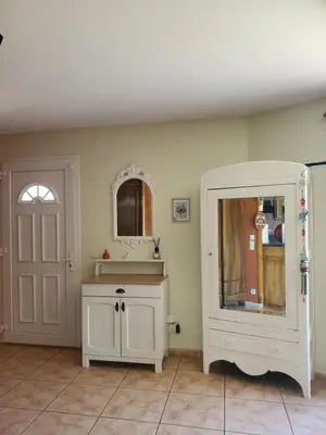 a bathroom with a white cabinet and a mirror at Villa privée au calme avec gand jardin et terrasse in Bout-du-Pont-de-Larn