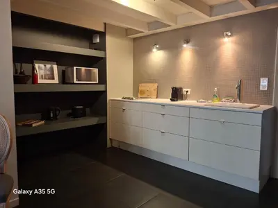 a kitchen with a sink and a counter top at The Cozy 42 stylish apartment in Carcassonne