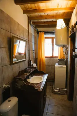 a bathroom with a sink and a toilet at Albizia in La Redorte
