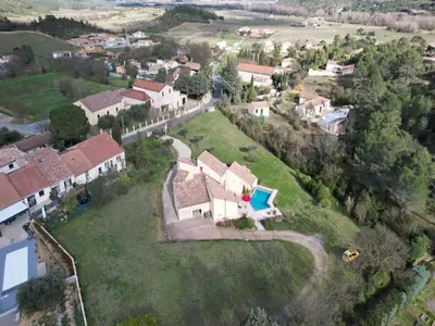 an aerial view of a house with a yard at Villa in France with Private Pool & Garden in Prades-sur-Vernazobre