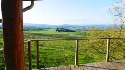 a balcony with a view of a green field at La Forge - calme absolu avec vue sur les Pyrenées in Villarzel-du-Razès