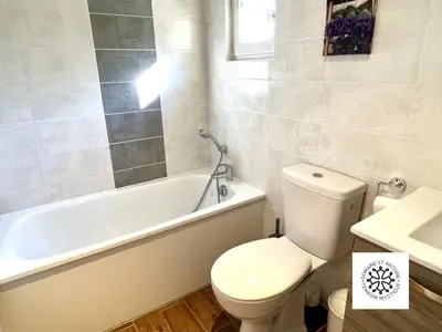a bathroom with a toilet and a tub and a sink at Domaine Saint Antoine in Rieux-Minervois