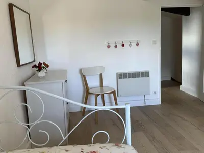 a room with a bed and a table and chairs at Domaine Saint Antoine in Rieux-Minervois
