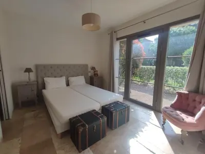 a bedroom with a bed with two suitcases on it at la redorte 25 in La Redorte
