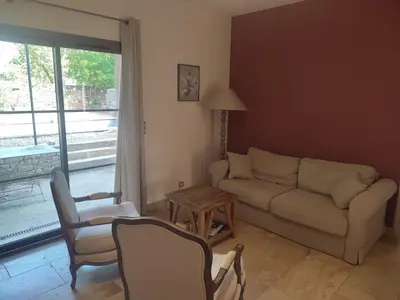 a living room with a couch and chairs and a table at la redorte 25 in La Redorte