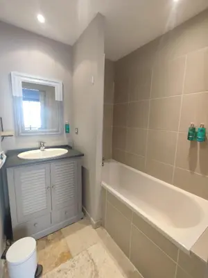 a bathroom with a bath tub and a sink at la redorte 25 in La Redorte