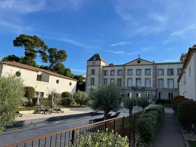 a view of a building with a fence at la redorte 25 in La Redorte